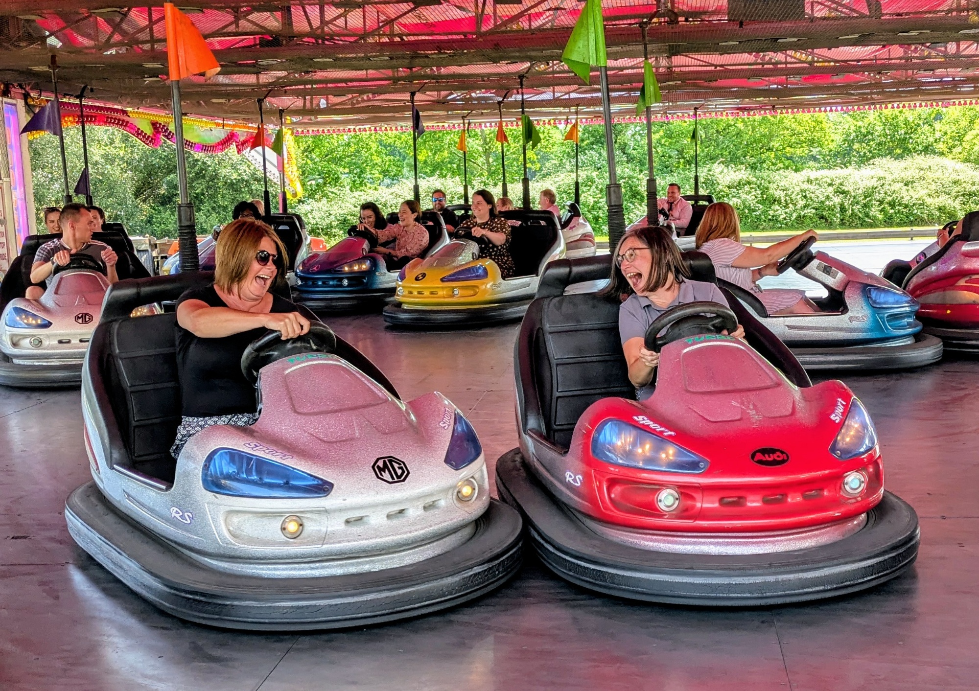 Image shows RSA Lead Mentors Kerrie and Alix on bumper cars at a recent school rewards day